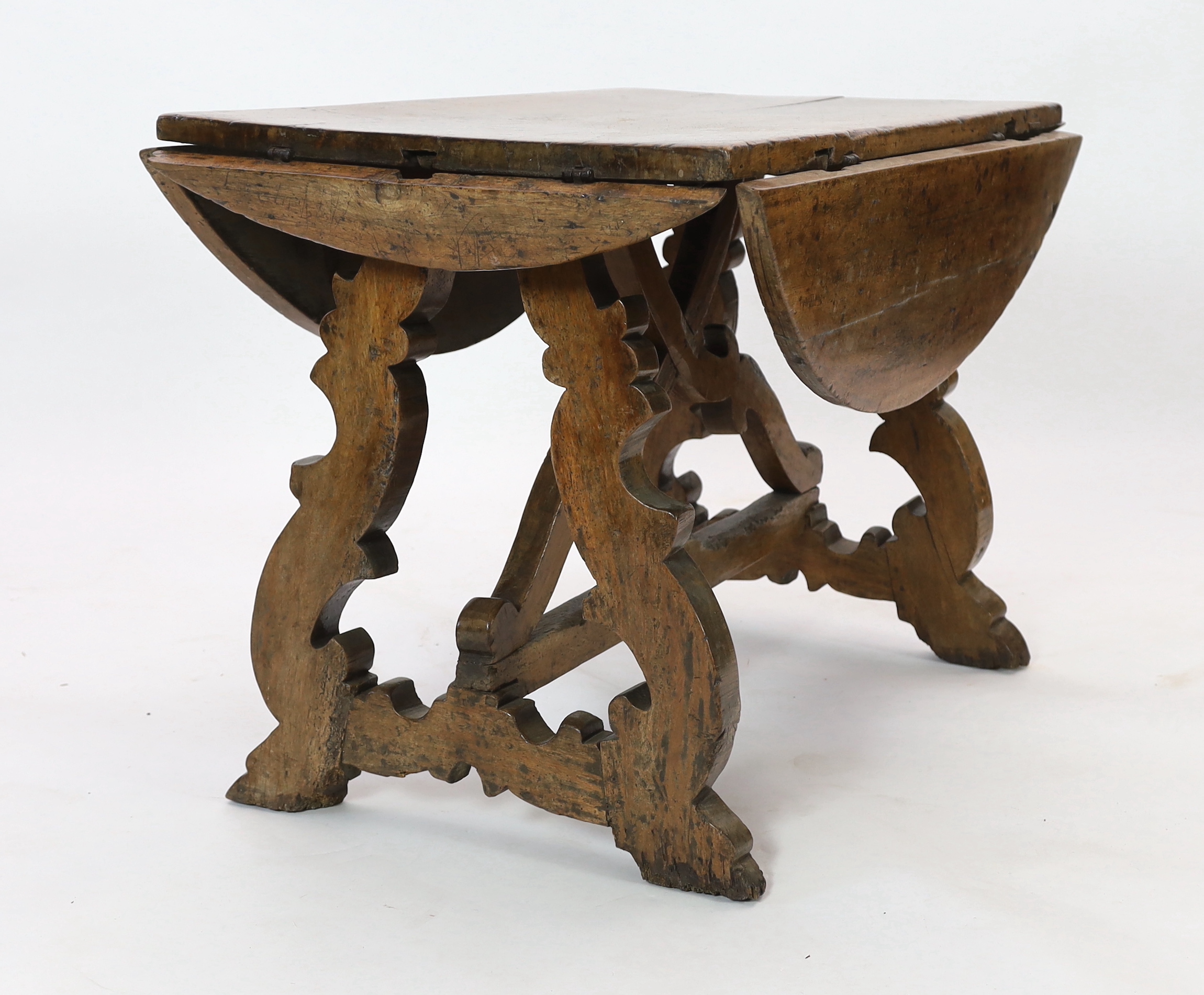 A mid 17th century Spanish walnut dining table, 115 x 74cm with flaps down, height 78cm